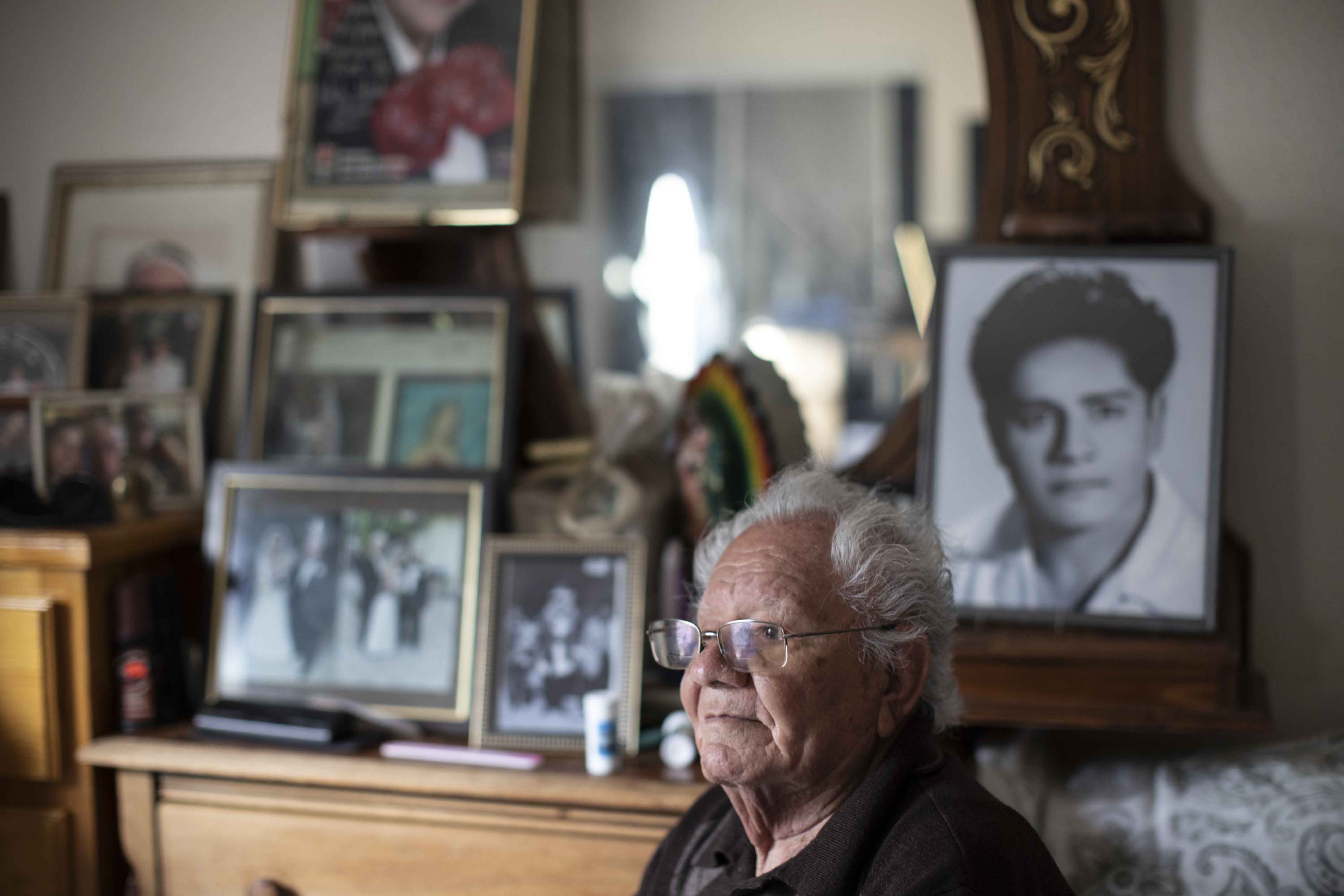 Francisco Rios, 91, sits in his bedroom filled with old photos, some from his younger days as a competitive ballroom dancer. When he wants to daydream, Rios puts on the music of his dancing days, listening to Glenn MIller and salsa music to reminisce.