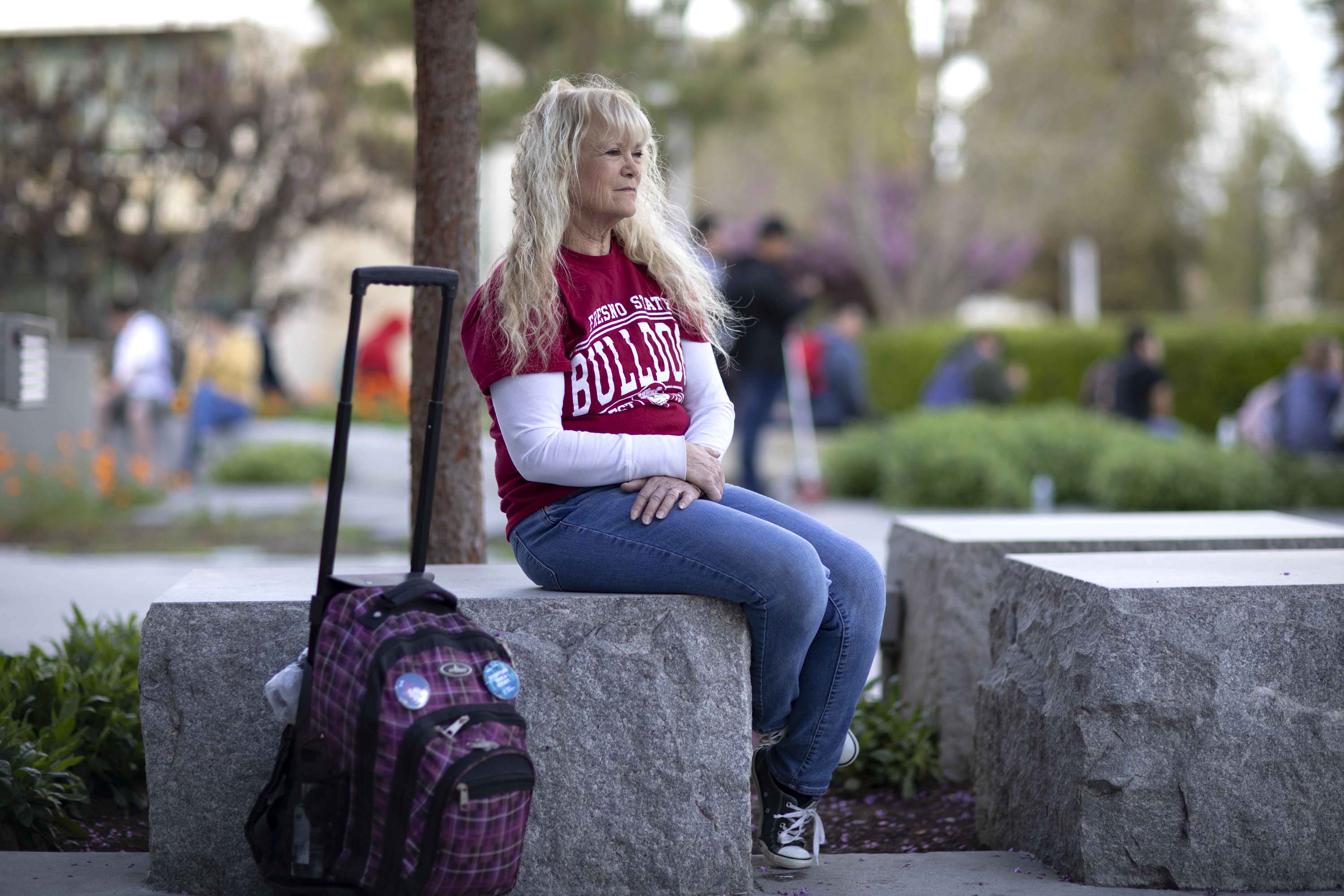 After decades working as an administrator at public colleges, Heidi Lofgren finally gets to go to school herself. She says that she spends an hour a day studying in the library.