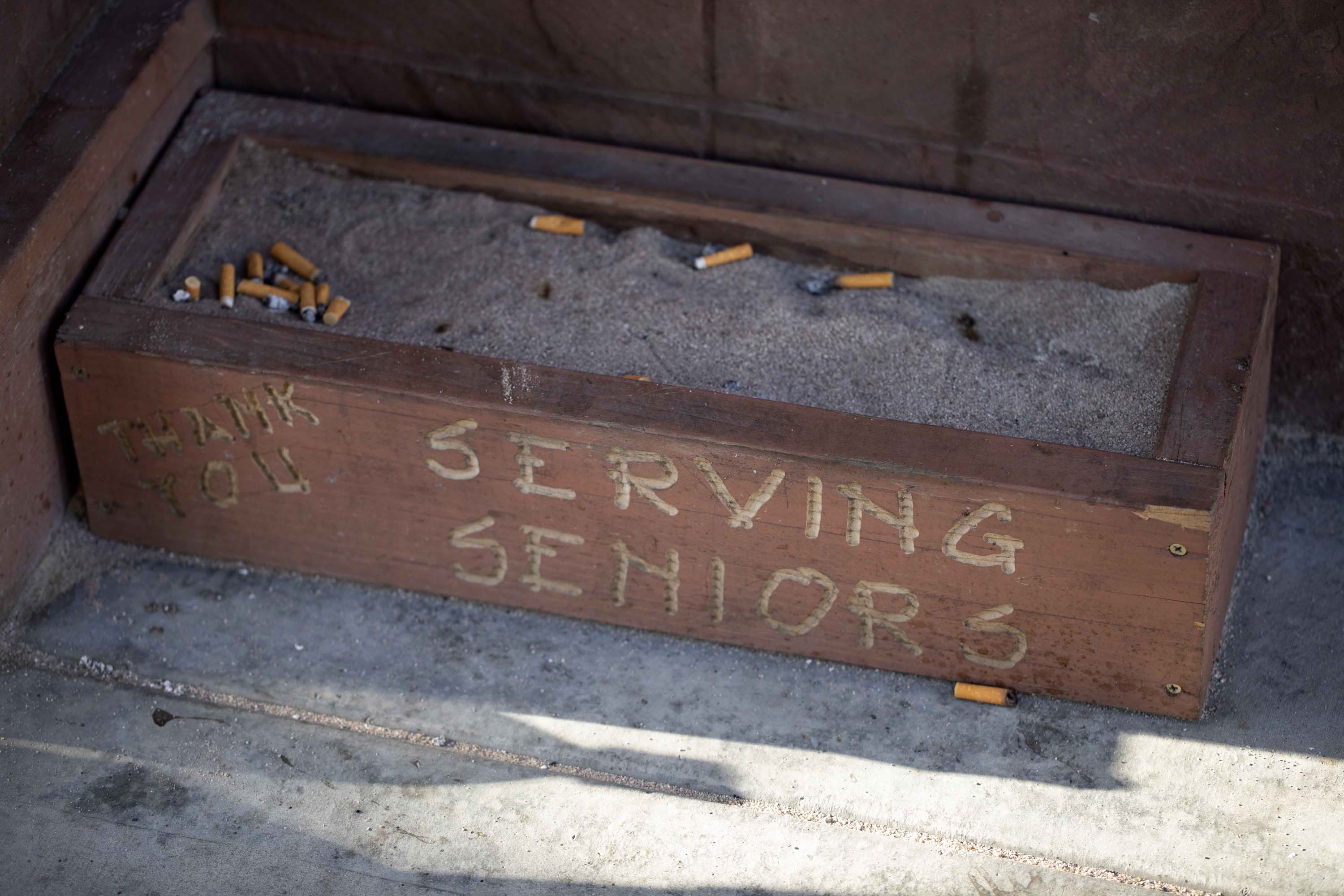 An ashtray attached to the side of the Gary and Mary West Senior Well Center where homeless senior, Carl Russell, showers and eats breaskfast everyday.