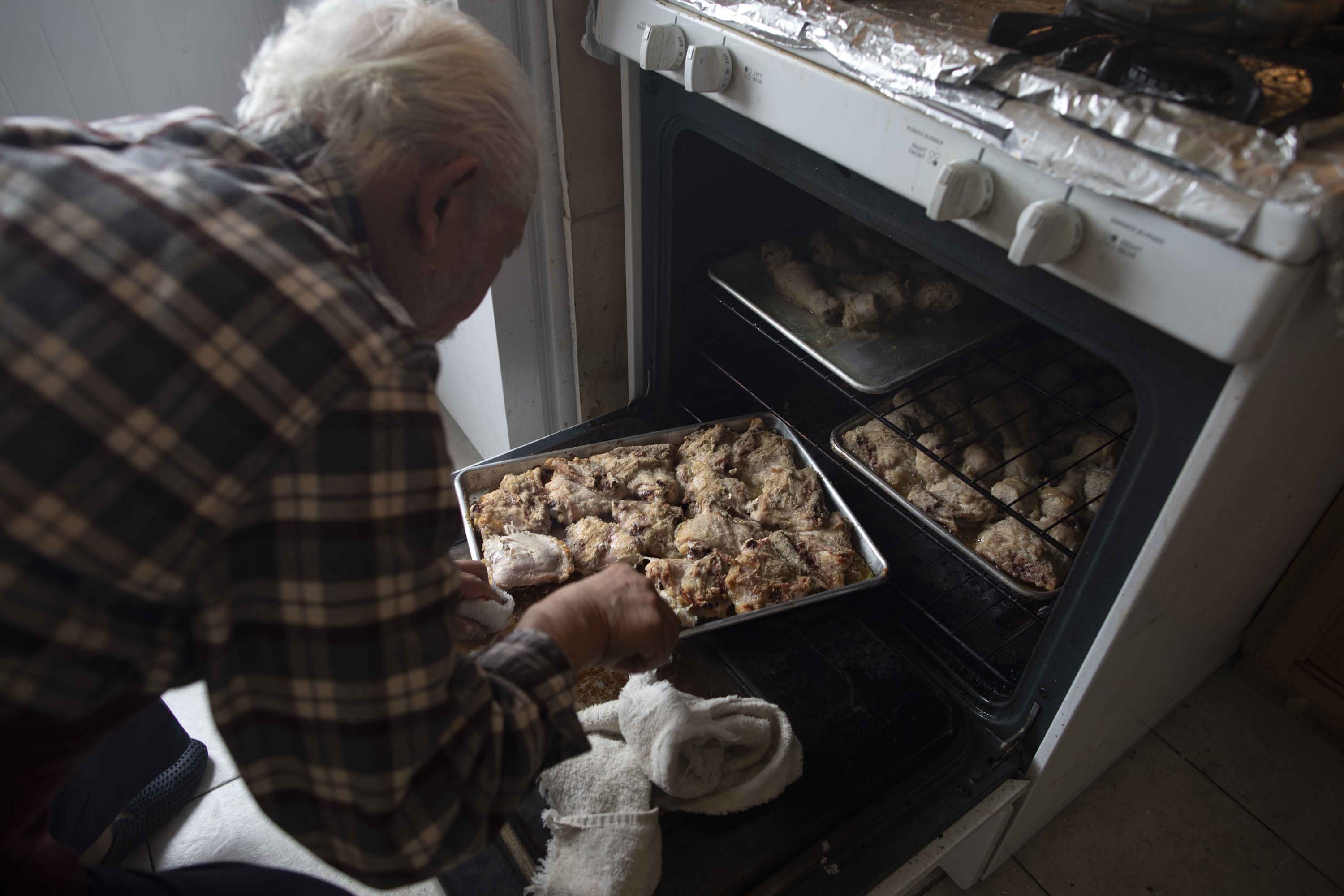 Emam Saber, 77, cooks at his San Francisco home. Saber, who is now retired, used to work as a chef at San Francisco hotels, including the St. Francis and Fairmont.